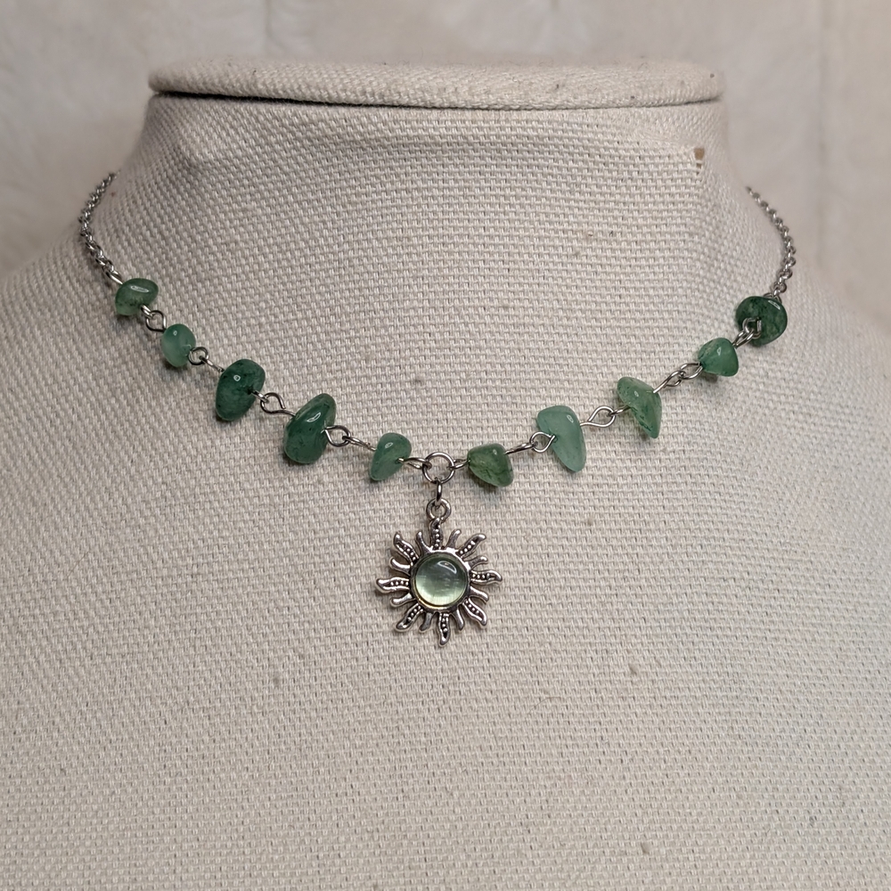 Chic Silver Necklace with Green Gemstones and Sun Pendant